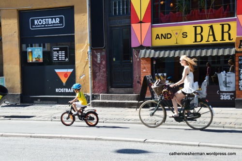 A mother and her son bike to the store together in Copenhagen, Denmark.