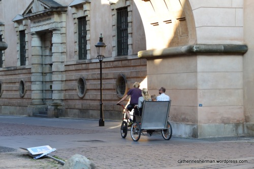 A pedicab enters an historic prison area at Slutterigade in Copenhagen. 